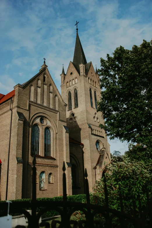 a church with a car parked in front of it, a photo, by Karl Pümpin, unsplash, romanesque, detmold, sunny day time, square, low detail