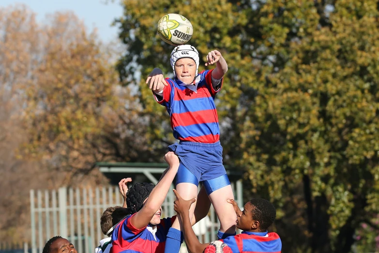 a group of young men playing a game of rugby, by Hubert van Ravesteyn, flickr, mid air, cute boy, upwards, thumbnail