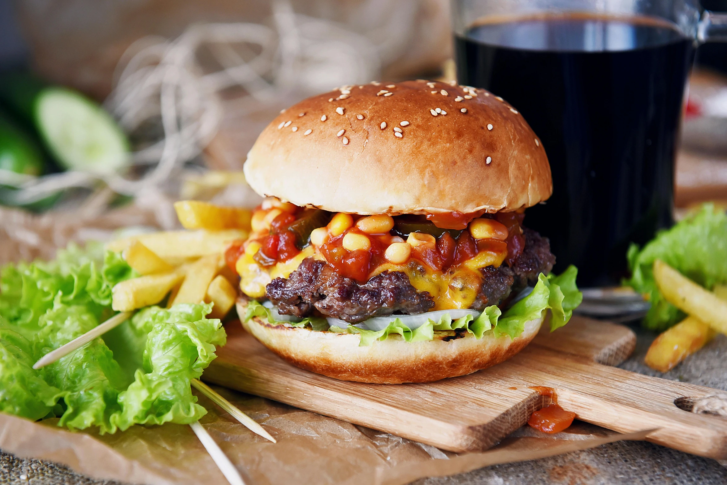 a hamburger sitting on top of a wooden cutting board, multicoloured, overflowing with baked beans, 💋 💄 👠 👗, getty images