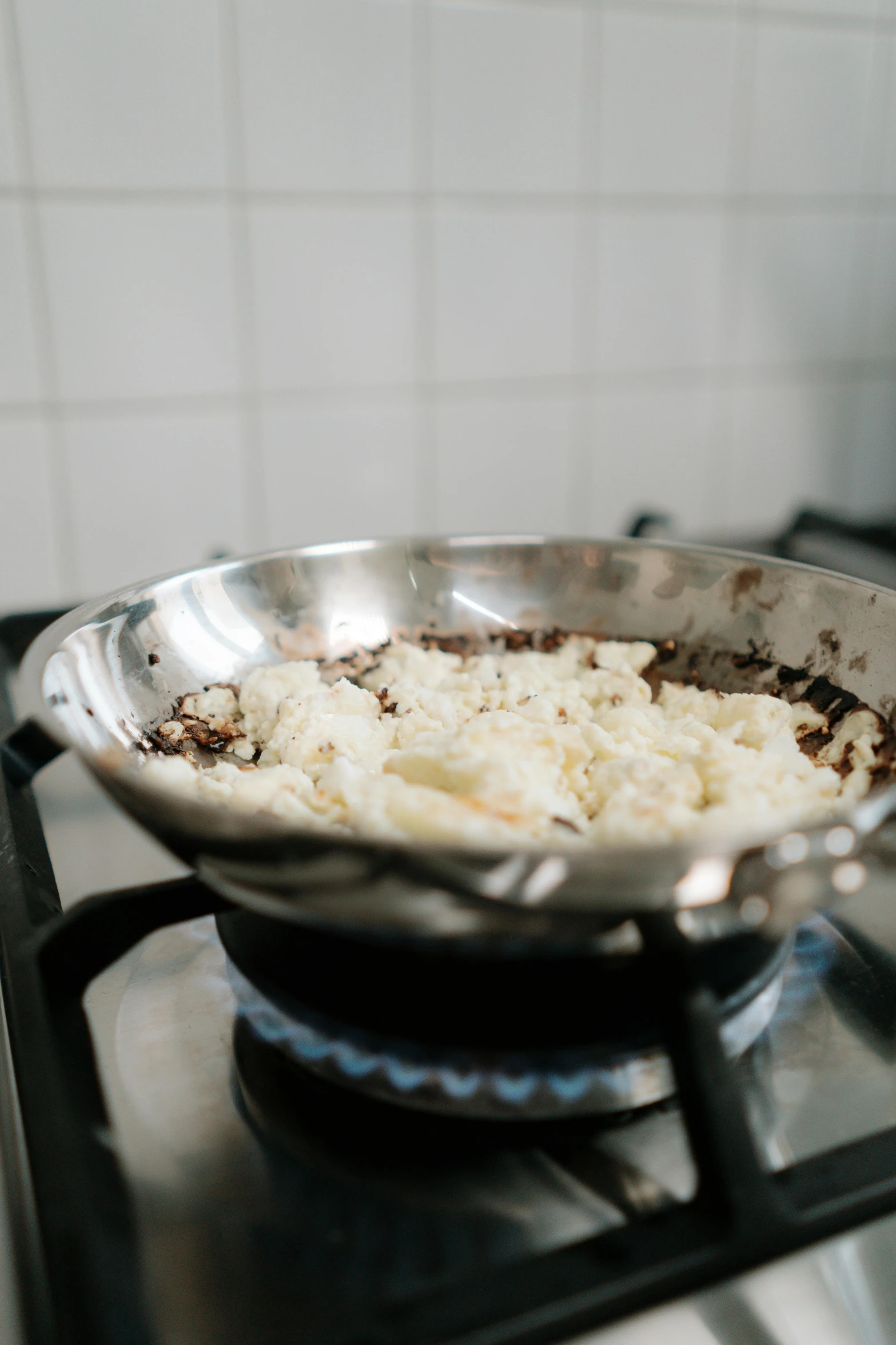 a frying pan sitting on top of a stove, mashed potatoes, minna sundberg, - 6