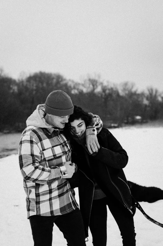 a man and woman standing next to each other in the snow, a black and white photo, tumblr, on a riverbank, 2019 trending photo, crystal castles, .eps