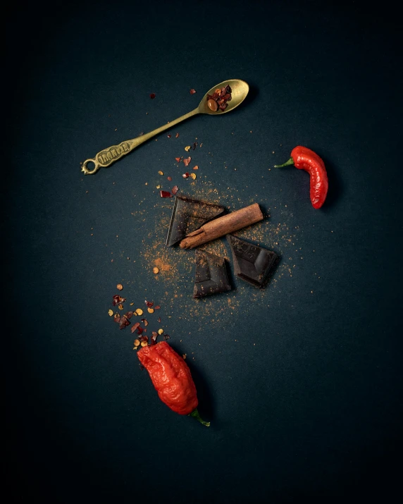 a couple of spoons sitting on top of a table, spicy, profile image, chocolate, detailed product image