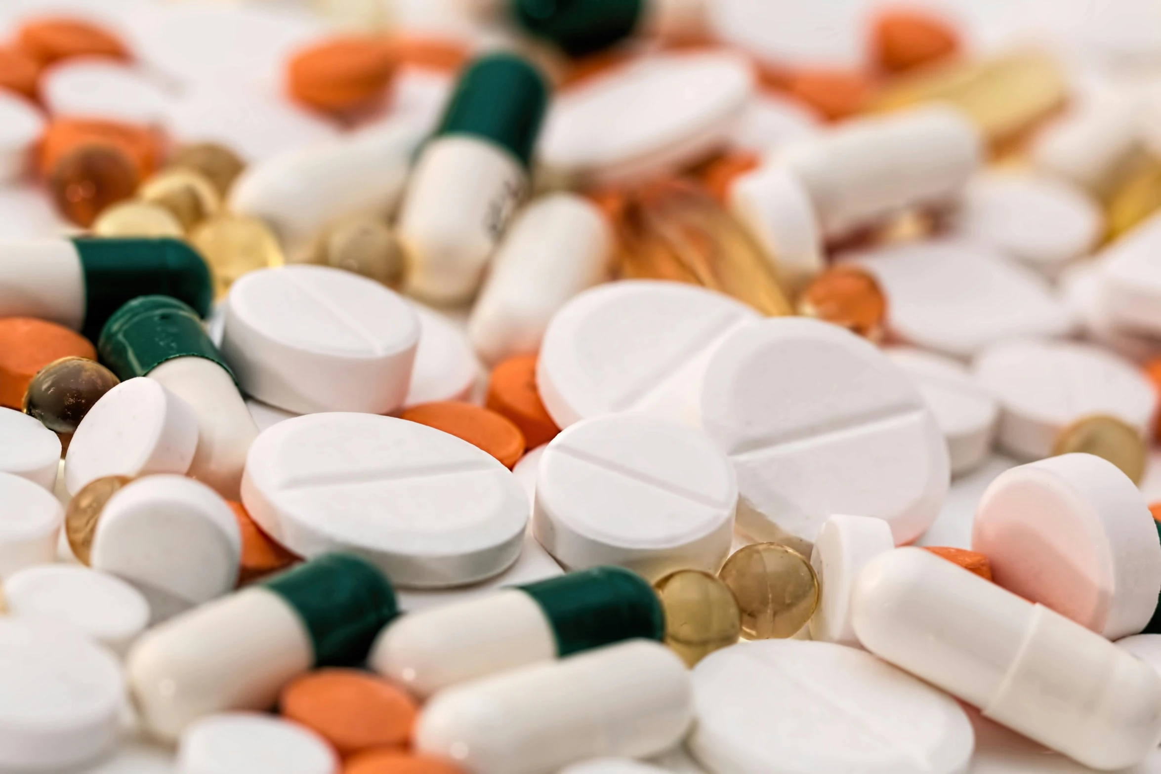 a pile of pills sitting on top of a table, pexels, antipodeans, neck zoomed in, sterile colours, white, medium detail