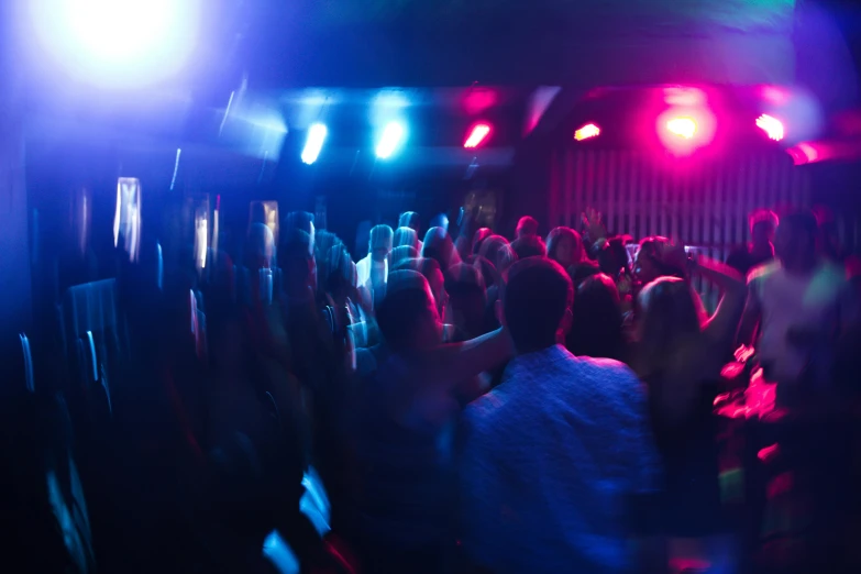 a group of people dancing at a party, pexels, happening, blue and red lights, audience, coloured, eight eight eight