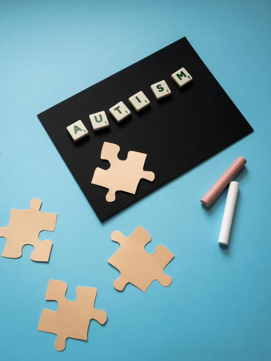 a piece of puzzle sitting on top of a table, blackboard, product photograph, dementia, flatlay