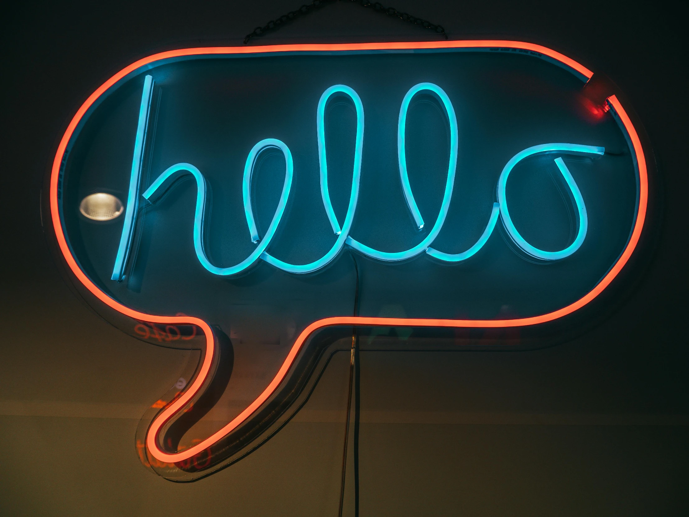 a neon sign that says hello in a speech bubble, by Niko Henrichon, pexels, mixed art, signed, mint, very large