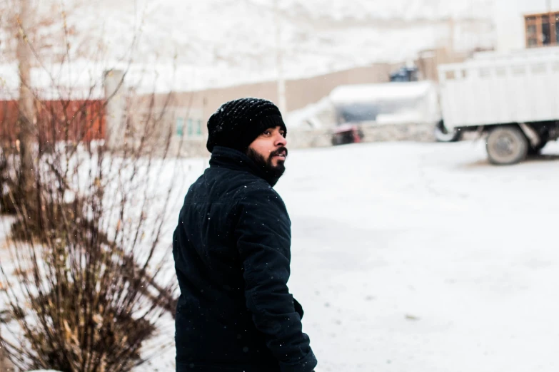 a man that is standing in the snow, by Muggur, pexels contest winner, les nabis, nekro petros afshar, casually dressed, profile image, street pic