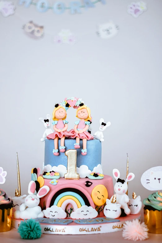 a cake sitting on top of a table next to cupcakes, by Julia Pishtar, cute girls, bunnies, having a cool party, thumbnail