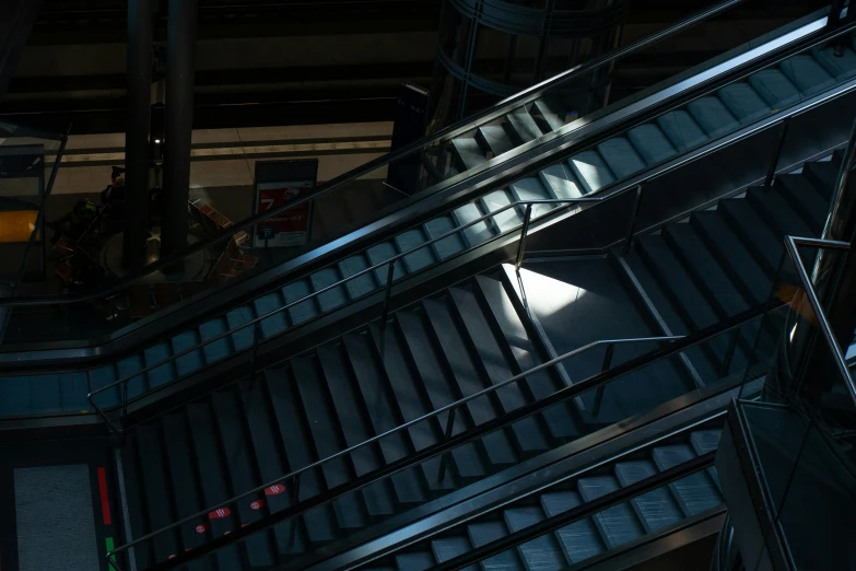 a man riding a skateboard down an escalator, inspired by Elsa Bleda, hyperrealism, cinematic unreal engine 5, alessio albi, dramatic lighting - n 9, rectangle