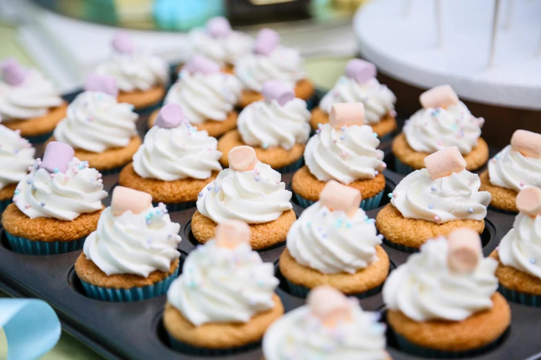 a close up of a tray of cupcakes with frosting, by Joe Bowler, pexels, square, bubbly, sea of parfait, white