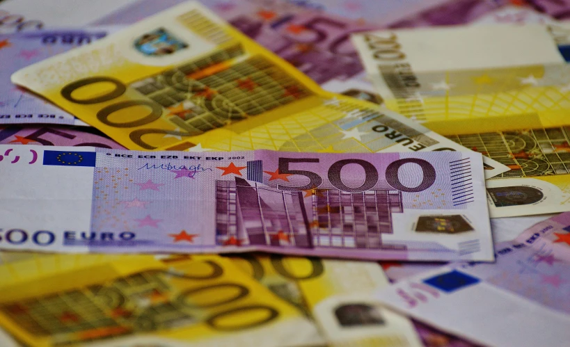 a pile of money sitting on top of a table, european union, avatar image, nice colors, thumbnail