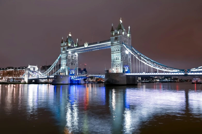 the tower bridge is lit up at night, pexels contest winner, holography, 8k resolution”, photo 4k, grey, panoramic