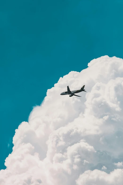 a large jetliner flying through a cloudy blue sky, by Carey Morris, pexels contest winner, minimalism, sitting in a fluffy cloud, 🚿🗝📝, profile image, avatar image