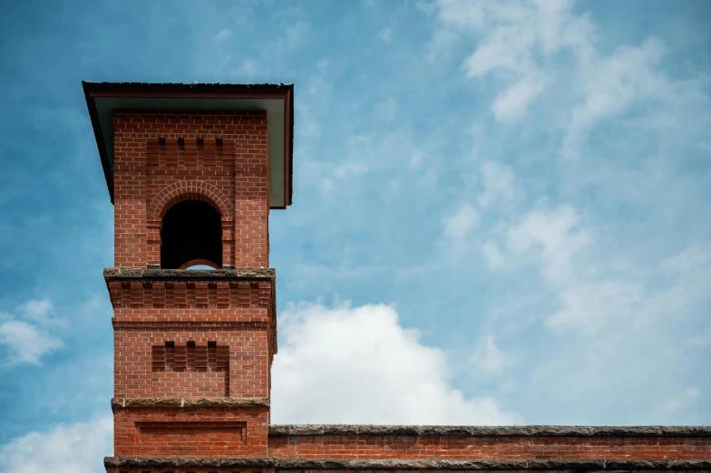 a clock tower on top of a brick building, inspired by Taddeo Gaddi, pexels contest winner, arts and crafts movement, nepal, profile image, minimalist photo, thumbnail