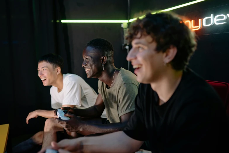 a group of men sitting next to each other playing a video game, pexels contest winner, renaissance, brown skin man with a giant grin, vitalik buterin, lee madgwick & liam wong, thin young male