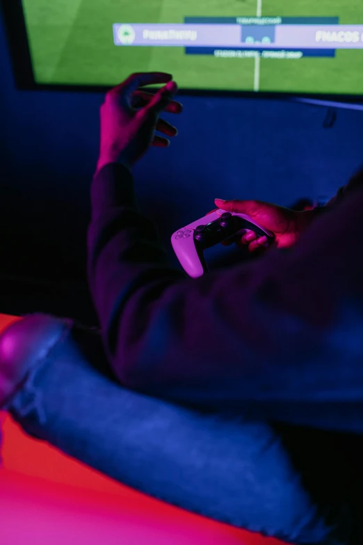 a person sitting in front of a tv playing a video game, pexels, muted deep neon color, chillin at the club together, bottom angle, dark. no text