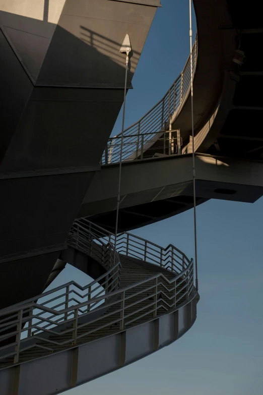 a man flying through the air while riding a skateboard, an abstract sculpture, inspired by Zaha Hadid, unsplash, brutalism, outdoor staircase, evening at dusk, hoog detail, sky bridge