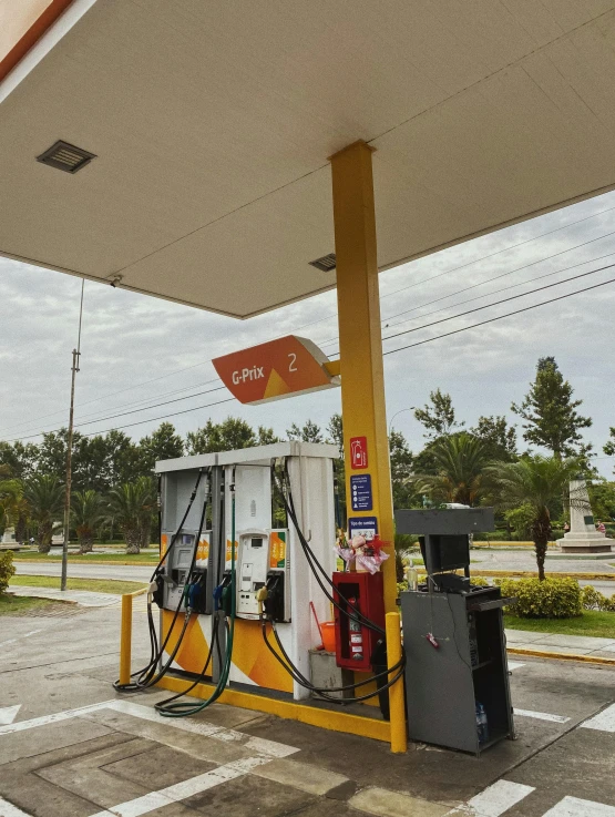 a gas station with a gas pump in the foreground, an album cover, instagram, hyperrealism, white and yellow scheme, 2 0 2 2 photo, cuba, canopies