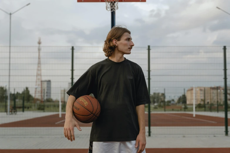 a man standing on a basketball court holding a basketball, by Attila Meszlenyi, dribble contest winner, 15081959 21121991 01012000 4k, dasha taran, real life size, black jersey