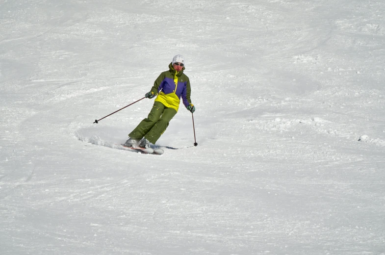 a man riding skis down a snow covered slope, a portrait, pexels contest winner, figuration libre, yellow, purple, a green, grey