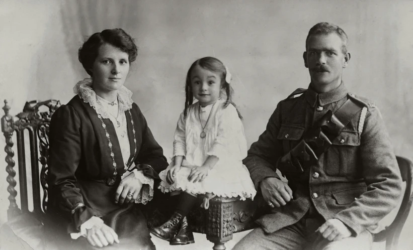 a black and white photo of a man and two children, inspired by Henry Tonks, portrait of a female soldier, digital image, backdrop, portrait of family of three