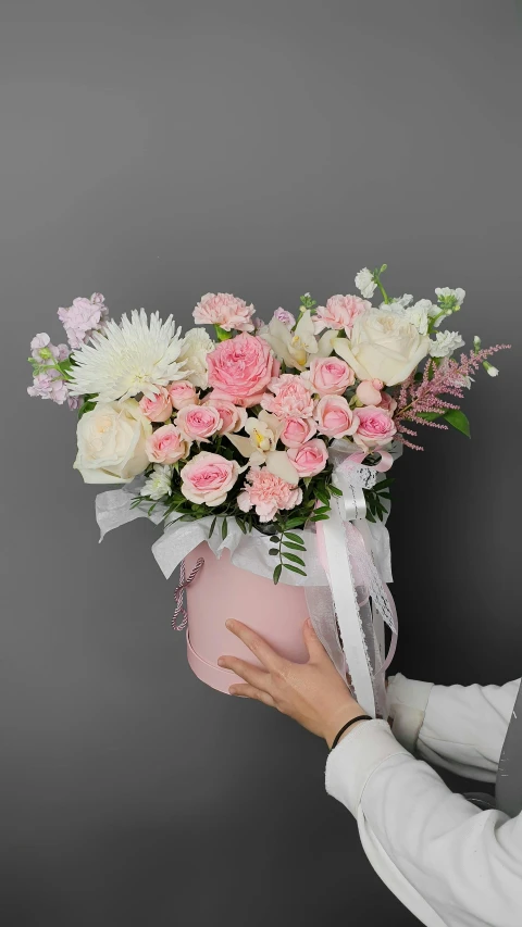 a woman holding a bouquet of pink and white flowers, inspired by Ni Yuanlu, romanticism, rose gold heart, pink axolotl in a bucket, light cream and white colors, lighthearted celebration