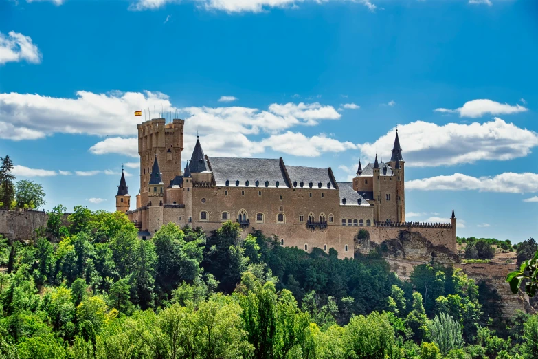 a castle sitting on top of a lush green hillside, an album cover, inspired by Luis Paret y Alcazar, pexels contest winner, renaissance, beige, exterior view, 2 5 6 x 2 5 6 pixels, madrid