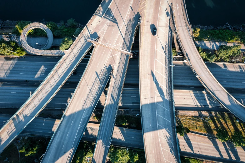 an aerial view of a bridge over a body of water, incoherents, highway to hell, thumbnail, ramps, multiple stories