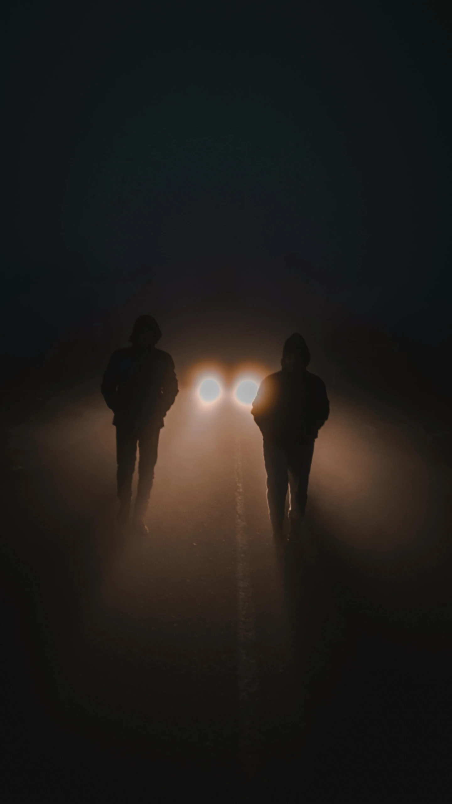 two people walking down a road at night, an album cover, by Matt Cavotta, pexels contest winner, symmetric lights and fog, two suns, concert, 15081959 21121991 01012000 4k