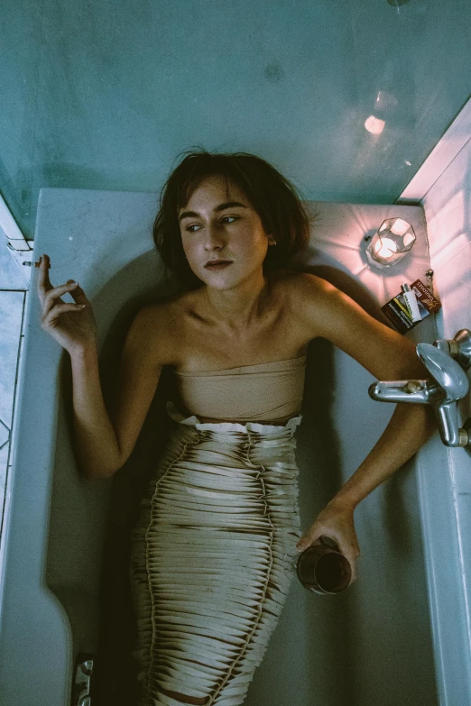 a woman in a bathtub smoking a cigarette, inspired by Nan Goldin, trending on pexels, natalia dyer, in a spaceship, carice van houten, gemma chen