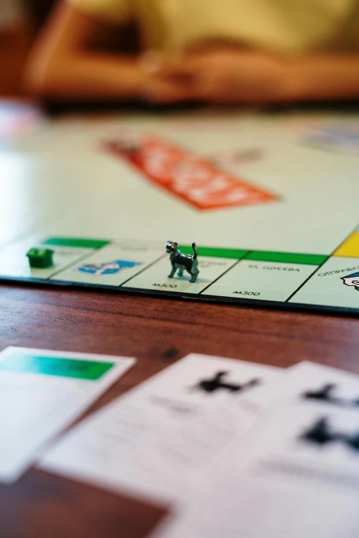 a close up of a board game on a table, a cartoon, by Carey Morris, unsplash, square, photographed for reuters, singapore, contain