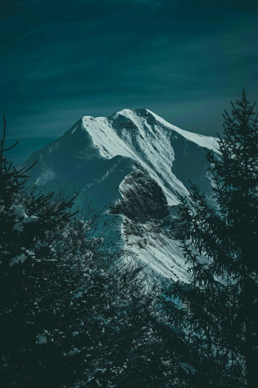 a snowy mountain with trees in the foreground, inspired by Elsa Bleda, unsplash contest winner, baroque, on a dark background, still frame the retro twin peaks, looking partly to the left, mount doom