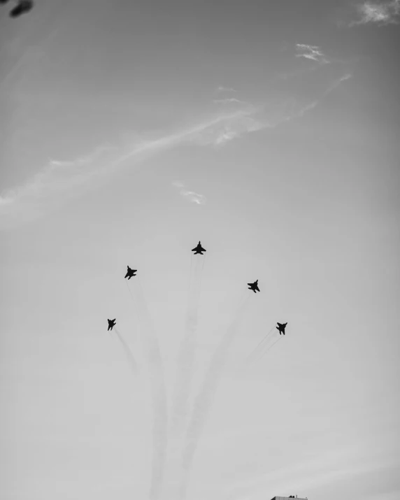 a group of jets flying through a cloudy sky, a black and white photo, unsplash, minimalism, “diamonds, maxim sukharev, concert, thunderbirds