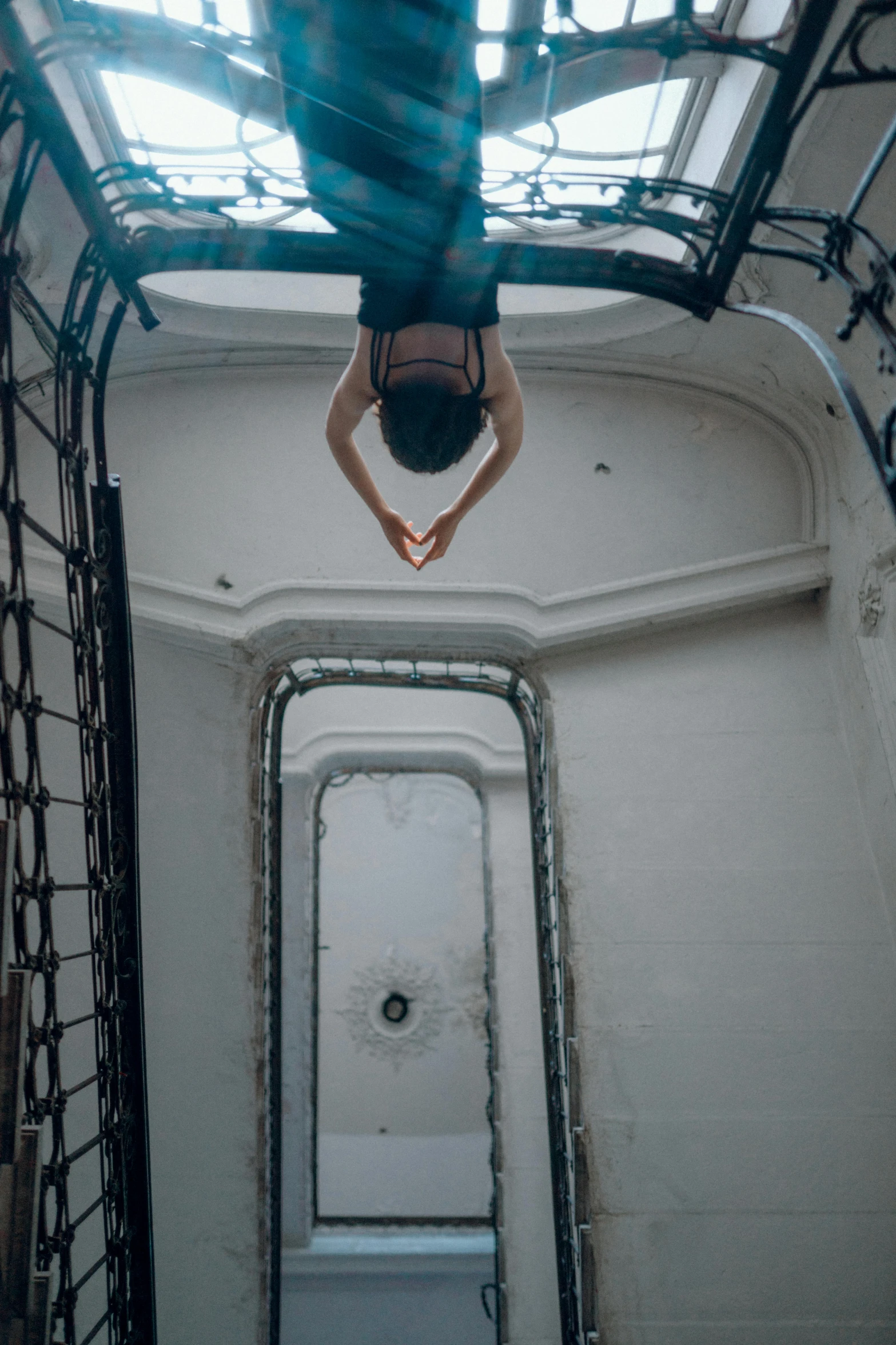 a man flying through the air on top of a staircase, inspired by Alexander Rodchenko, unsplash contest winner, arabesque, inside an underwater train, low quality photo, dasha taran, square