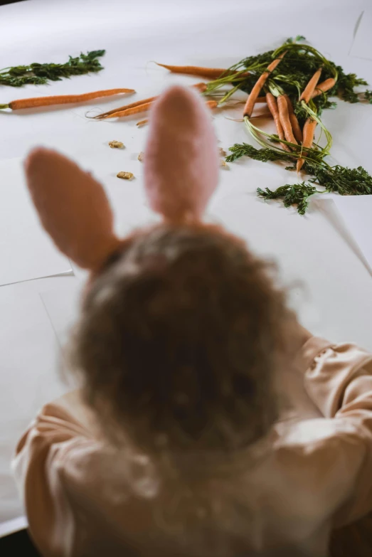 a child in bunny ears looking at carrots on a table, inspired by Elsa Beskow, pexels contest winner, curls on top, playboy bunny, organic detail, cut out