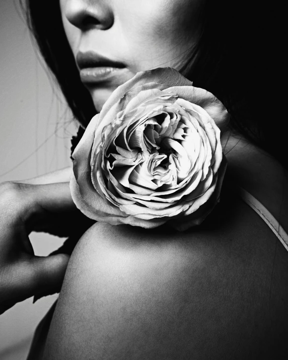 a black and white photo of a woman holding a flower, 3 0 0, mario testino, large)}], natural point rose'