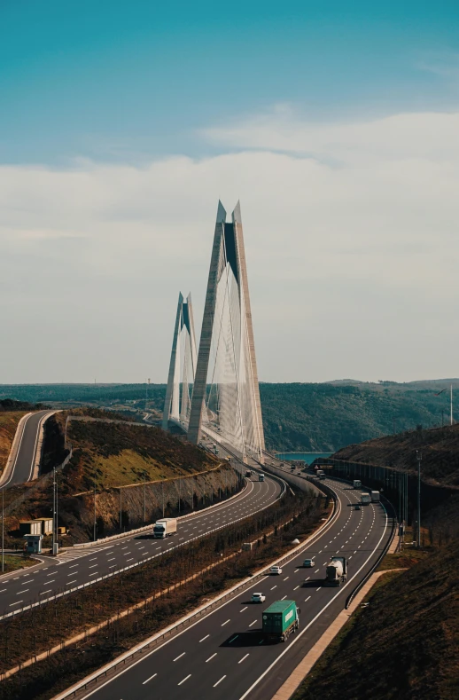 an aerial view of a highway with a bridge in the background, by Alejandro Obregón, pexels contest winner, renaissance, two towers, portugal, 🚿🗝📝