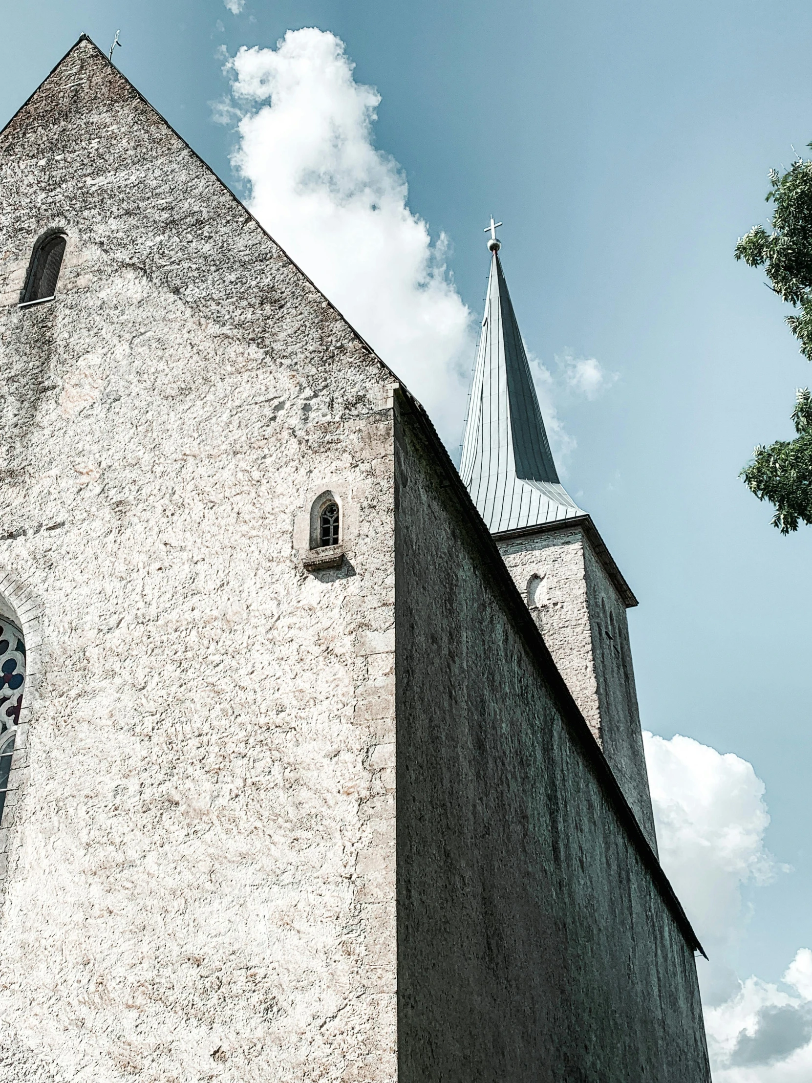 a very tall building with a clock on it's side, an album cover, by Kristian Zahrtmann, pexels contest winner, romanesque, church in the wood, panorama view, grey, windows and walls :5