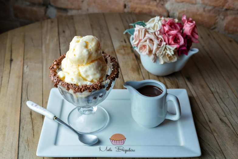 a dessert sitting on top of a white plate next to a cup of coffee, a pastel, inspired by Max Buri, les nabis, honey birdette, bowl, chocolate frosting, unga bunga