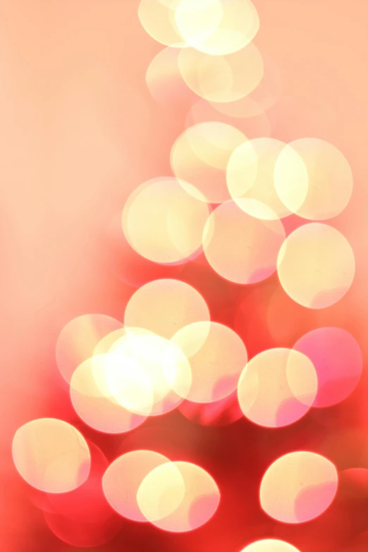 a close up of a christmas tree with lights, by David Donaldson, minimalism, soft red tone colors, bubbly, pale red, dots abstract