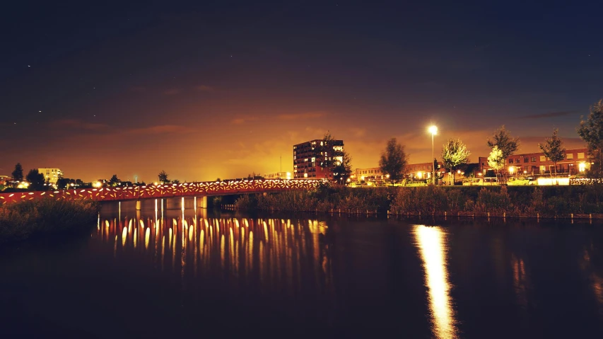 a bridge over a body of water at night, a picture, by Adam Marczyński, hurufiyya, tilt shift”, instagram picture, hq print, helmond