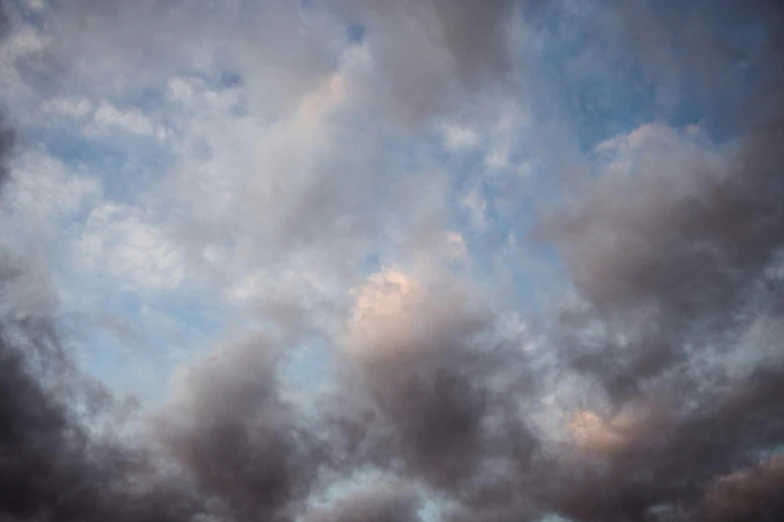 a couple of kites flying through a cloudy sky, unsplash, romanticism, cloud nebula, color ( sony a 7 r iv, early evening, alessio albi