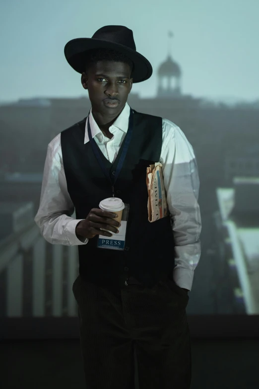 a man in a hat and vest holding a cup of coffee, inspired by Gordon Parks, cg society contest winner, adut akech, award winning movie still, high rises, [ theatrical ]