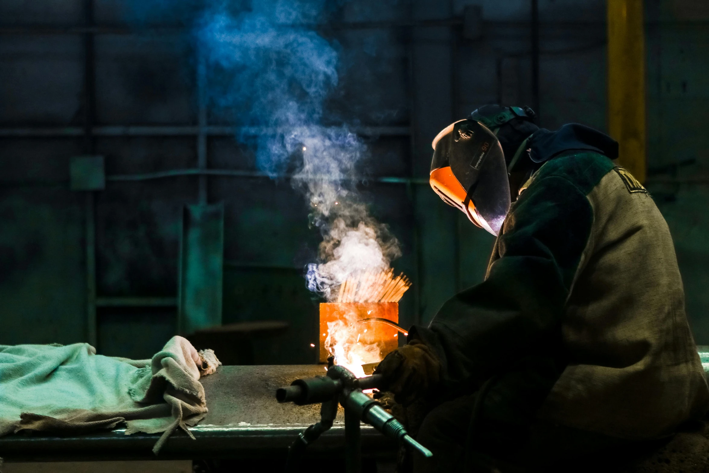 a welder working on a piece of metal, by Lee Loughridge, pexels contest winner, process art, australian, smoky laboratory, worksafe. instagram photo, thumbnail