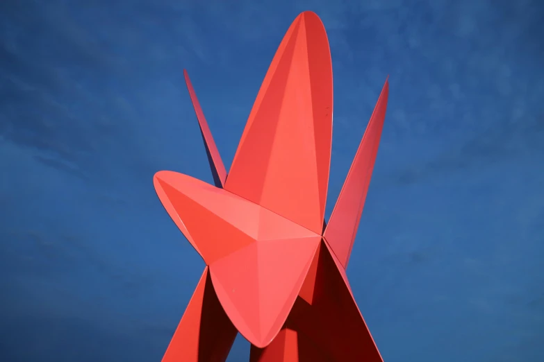 a sculpture of a red bird against a blue sky, an abstract sculpture, unsplash, new sculpture, seven pointed pink star, folded, fins, rhys lee