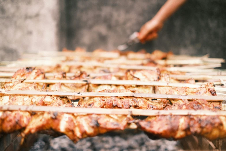 a close up of meat on skewers on a grill, by Emma Andijewska, reggae, profile image, panels, very crispy