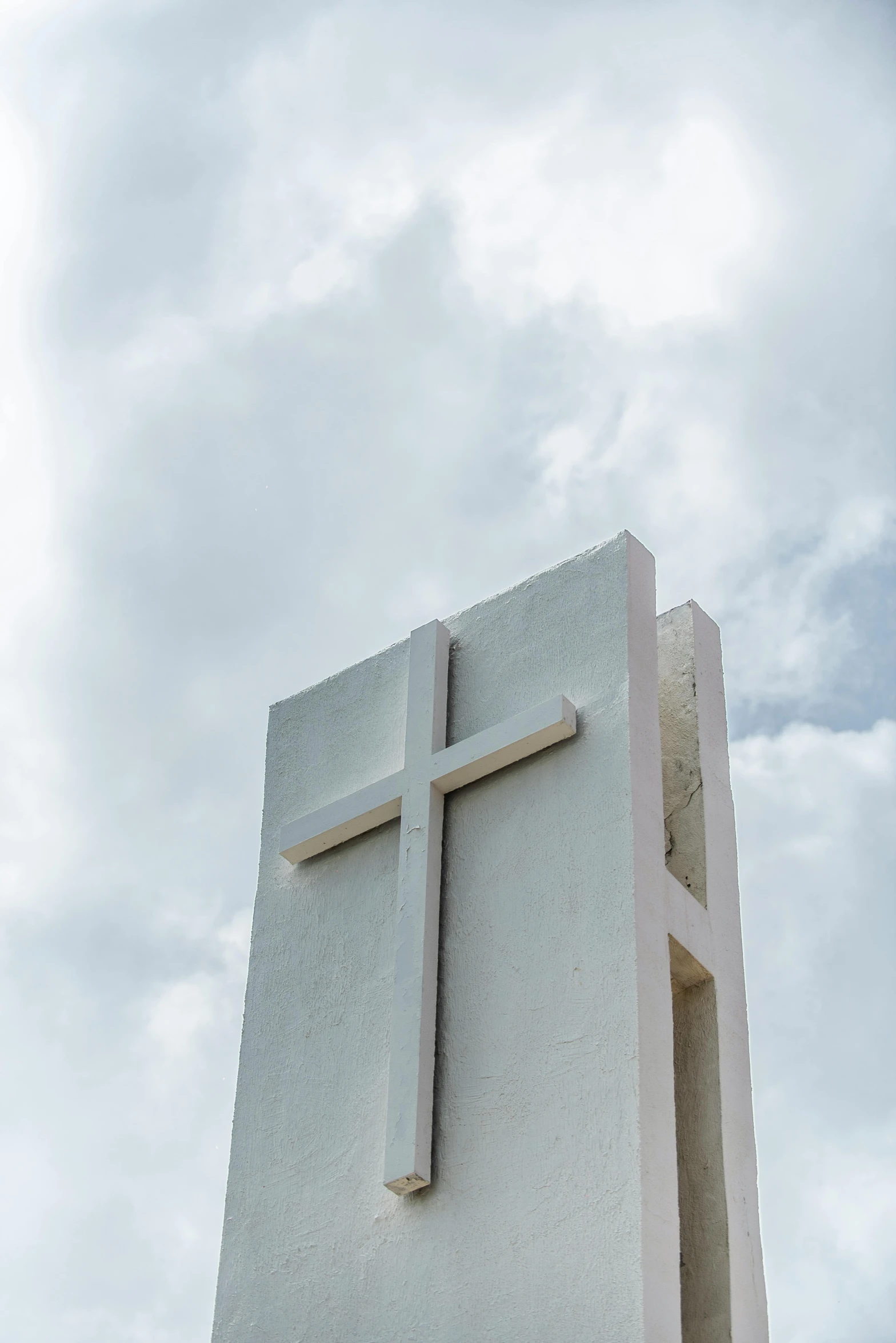 a white monument with a cross on top of it, by Robbie Trevino, unsplash, minimalism, square, puerto rico, made of concrete, tall thin build