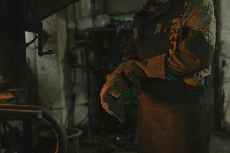 a man that is standing in a room, cast iron material, gloves on hands, industries, thumbnail