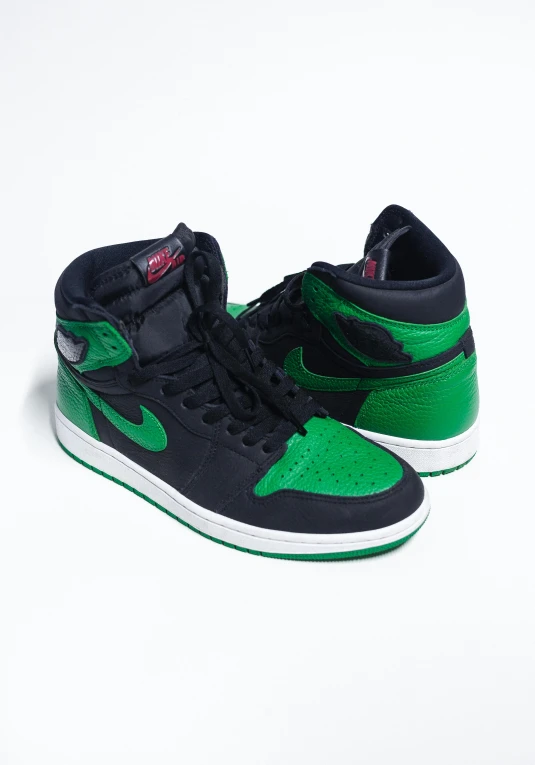 a pair of green and black sneakers on a white surface, an album cover, air jordan 1 high, ebay listing thumbnail, full face view, high angle close up shot
