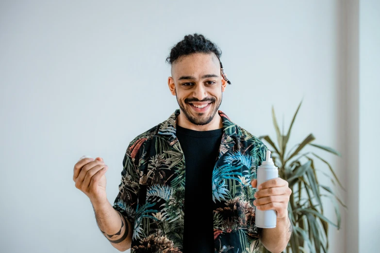 a man holding a toothbrush in one hand and a toothpaste in the other, a photo, by Matija Jama, pexels contest winner, antipodeans, mixed race, carrying a bottle of perfume, avatar image, smiling male